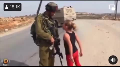 Little girl tries to stop a soldier