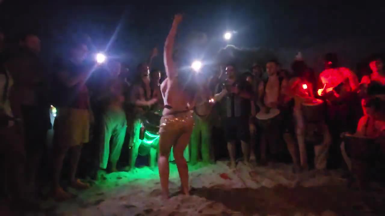 Dancing with fire at the Miami Beach full Moon drum circle, August 30, 2023