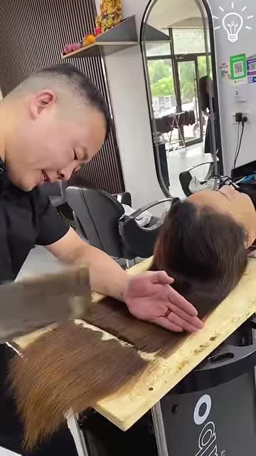 Chopping her hair in a weird way