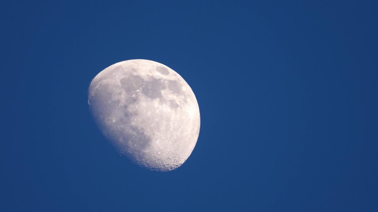 Half moon in the blue sky