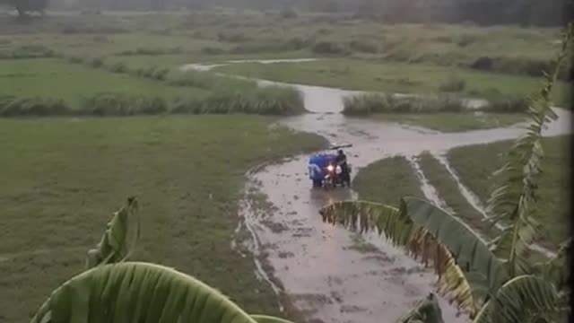 Water Delivery Man Determined to Escape Muddy Field