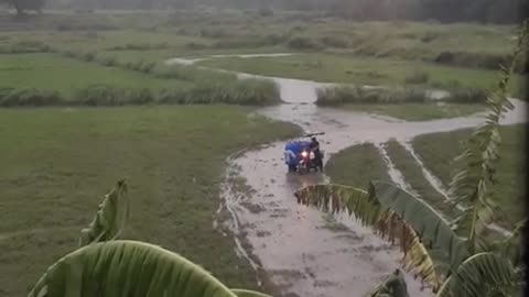 Water Delivery Man Determined to Escape Muddy Field