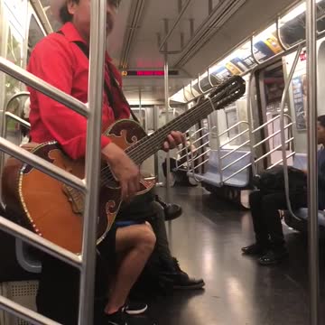 Two man mariachi singing subway cowboy hat