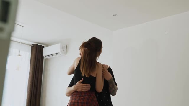 Cute Couple Dancing in the Room