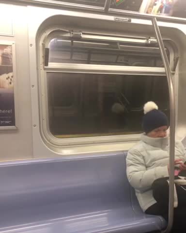 Guy gets out of train in the middle of the tunnel and walks alongside the train as it starts moving slowly