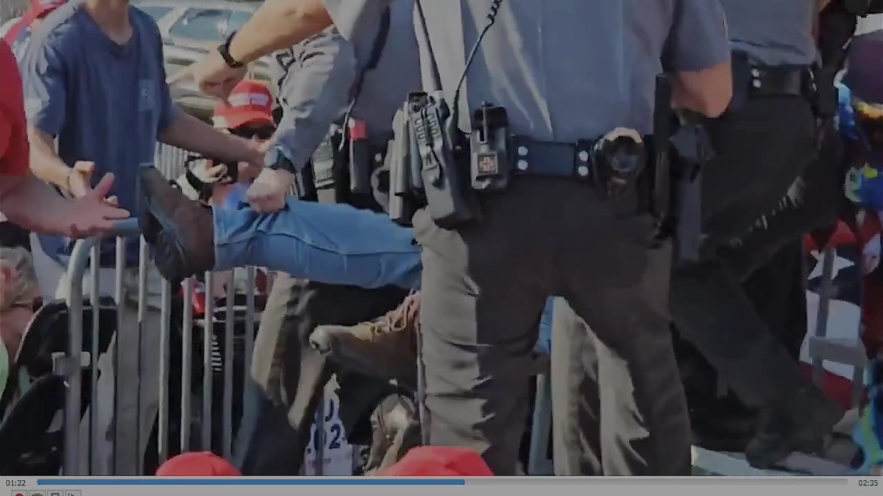 slow motion video of the guy being carried away after trump's assassination attempt