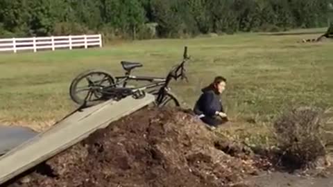 Black outfit bike stuck ramp launch