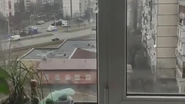 Russian tank swerves in to civilian car crushing it with people inside.