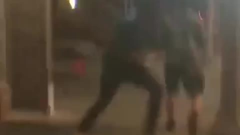 Blue shirt kicking trash can and falling