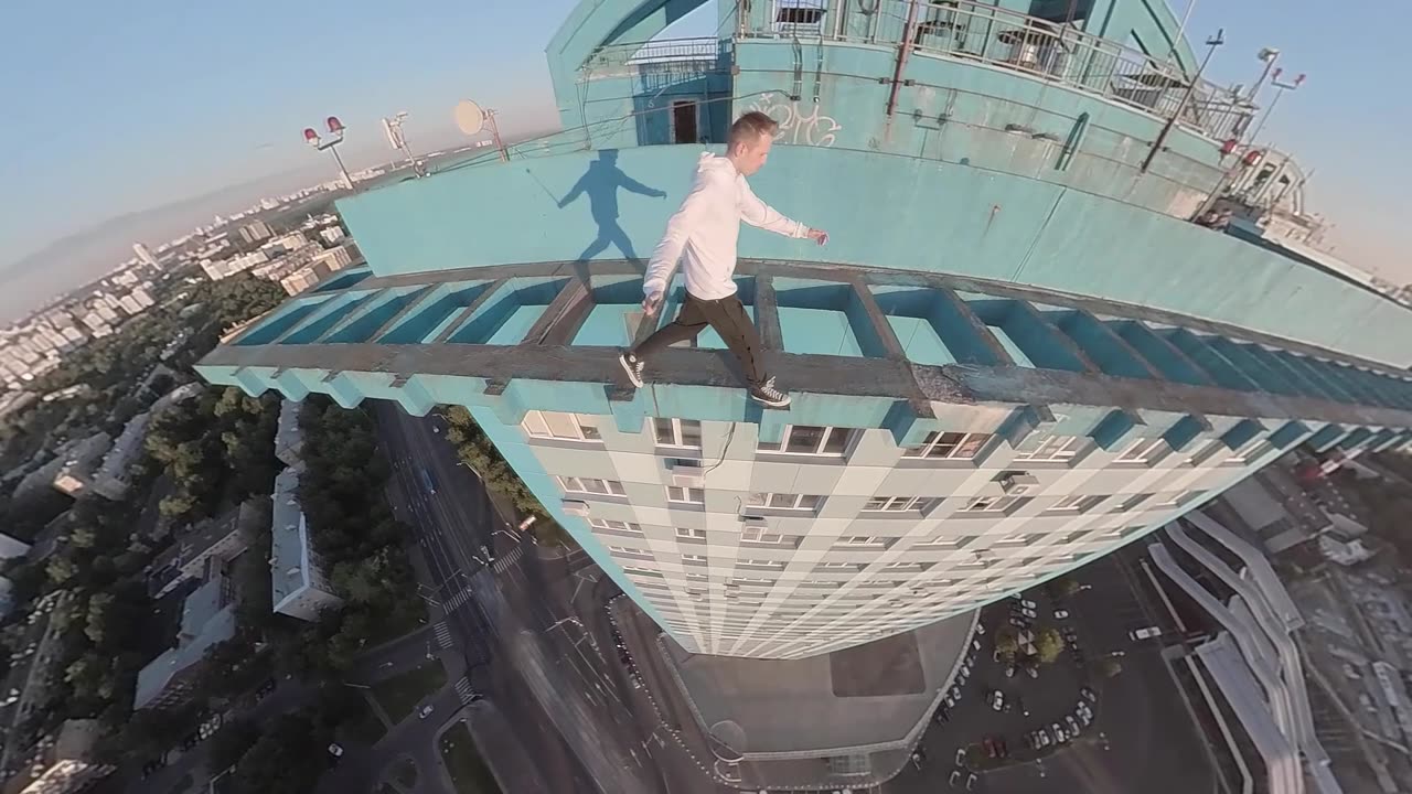 Daredevil Makes Precarious Dash Across High-Rise Rooftop