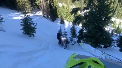 400 Pound Snowmobile Rolls Over Driver