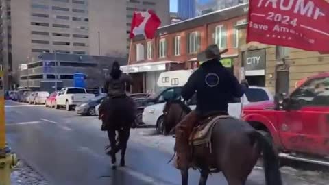 TRUMP 2024 flag brought in by horseback in downtown Ottawa