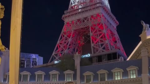 Beneath the dazzling lights of Las Vegas, the Eiffel Tower stands tall as a captivating backdrop. 🌃✨