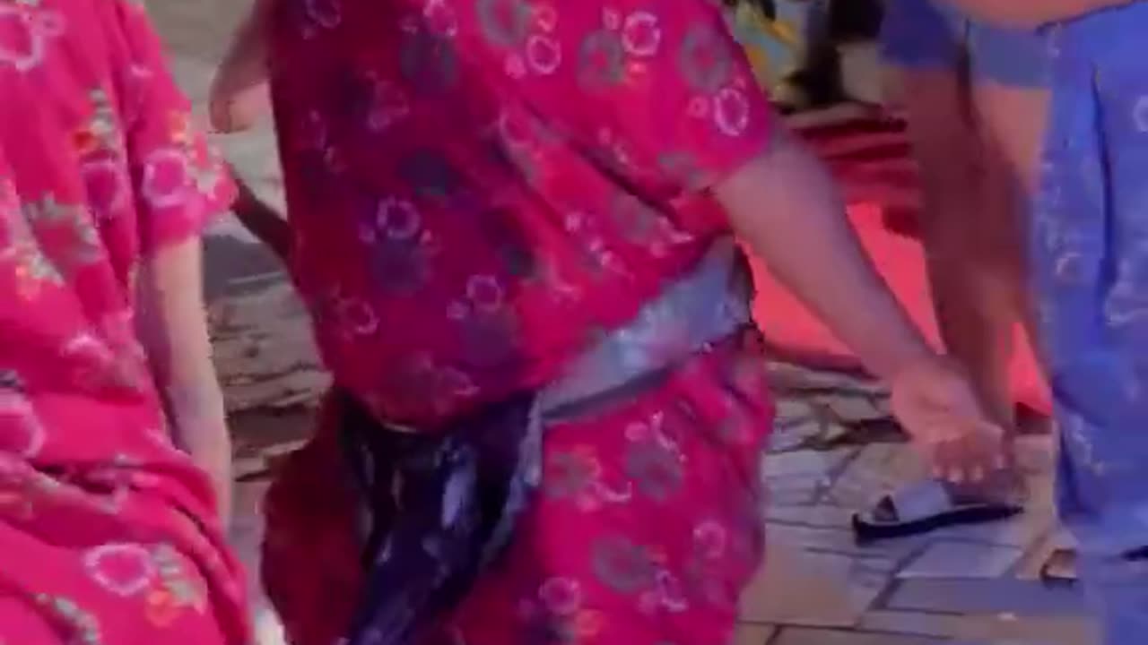 Women in Africa twerking on bottle.