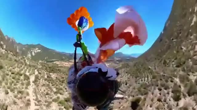 A paraglider had an extremely close call when his parachute