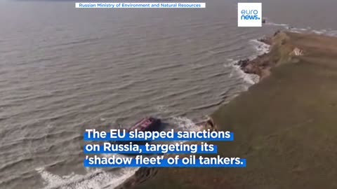 Oil stains wash ashore after storm damages Russian oil tankers