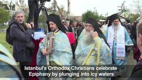 Istanbul's Orthodox Christians jump in icy water for Epiphany