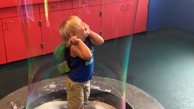 Cute Kid in a Big Bubble