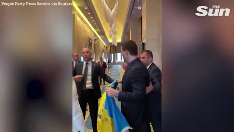 Fist fight erupts when Russian diplomat rips down Ukrainian flag at conference