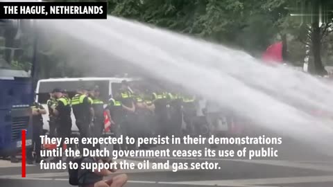 Dutch police use water cannon on climate activists