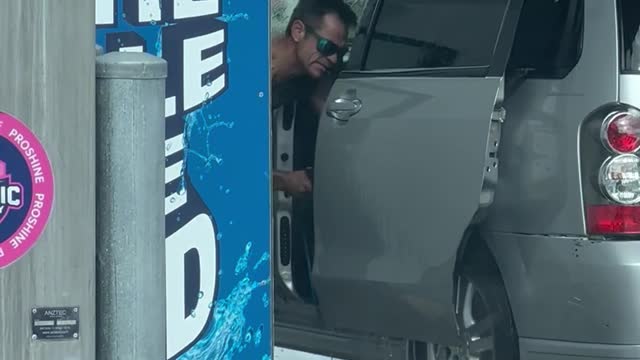 Man Uses Power Washer on Car Interior