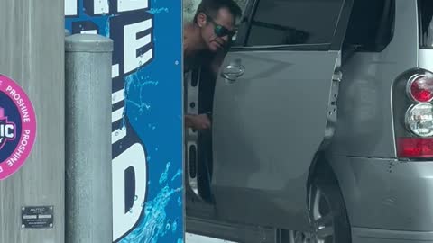 Man Uses Power Washer on Car Interior
