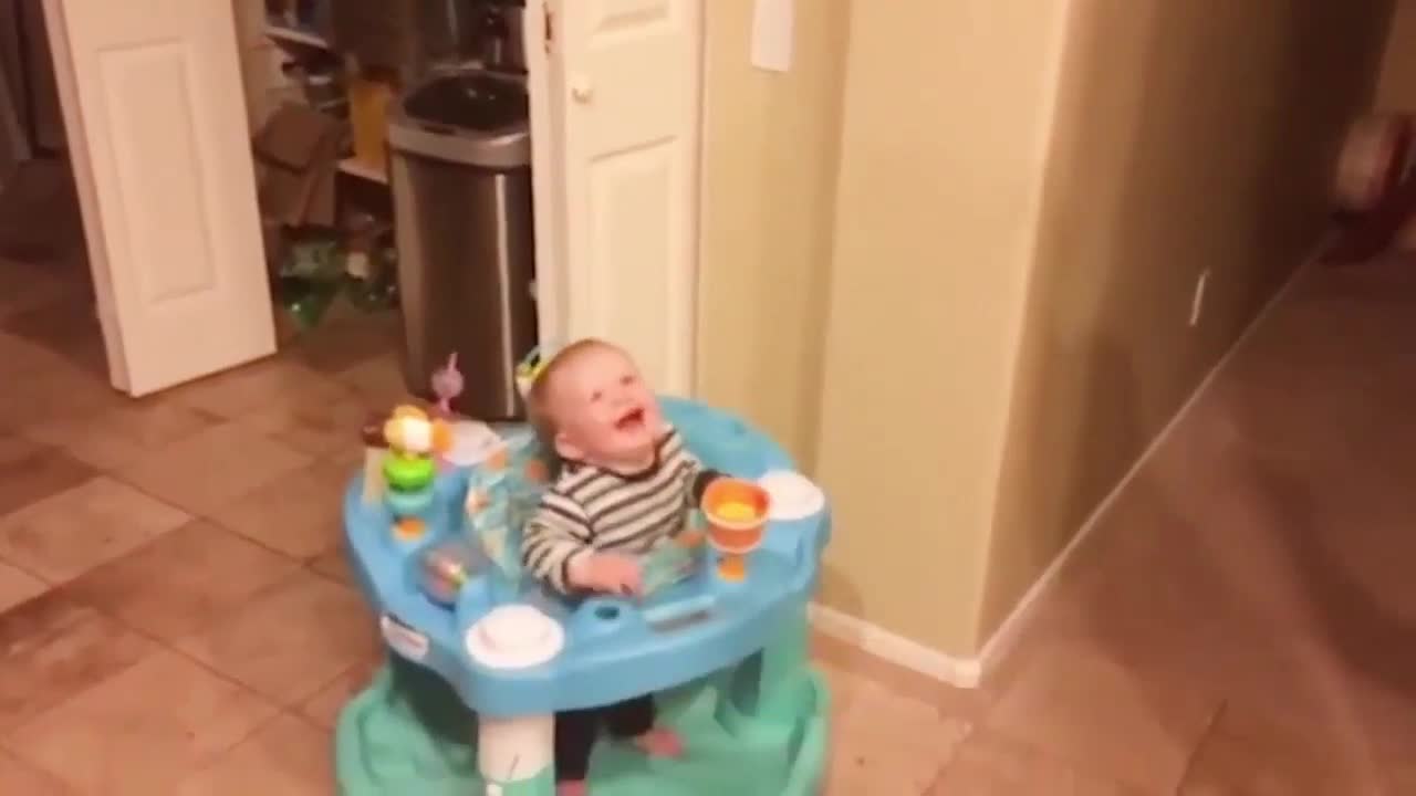 Baby Happy to See Dog Catches Bubbles