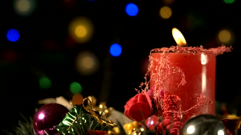 Red candle with Christmas decorations