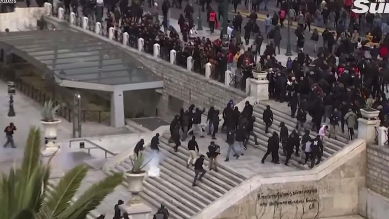 Riot police use to your gas on protesters in violent clash of a train crash in Greece