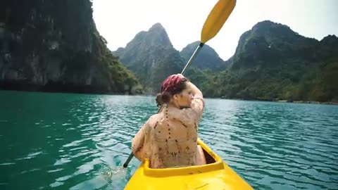 Woman kayaking in Halong