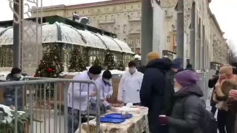 On Tverskaya, at the monument to Dolgoruky, the National Guards treat passers-by with hot tea with