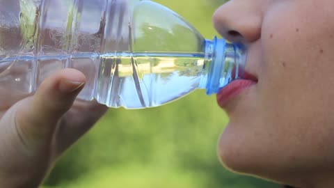 A girl drinks water