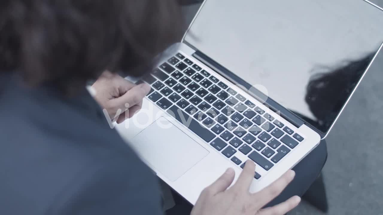 Cropped Shot Of Laptop And Hands Of Business Woman Sitting Outside And Typing