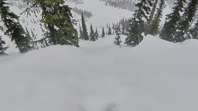 Heli-Snowboarder Caught in Snow Slide in Backcountry