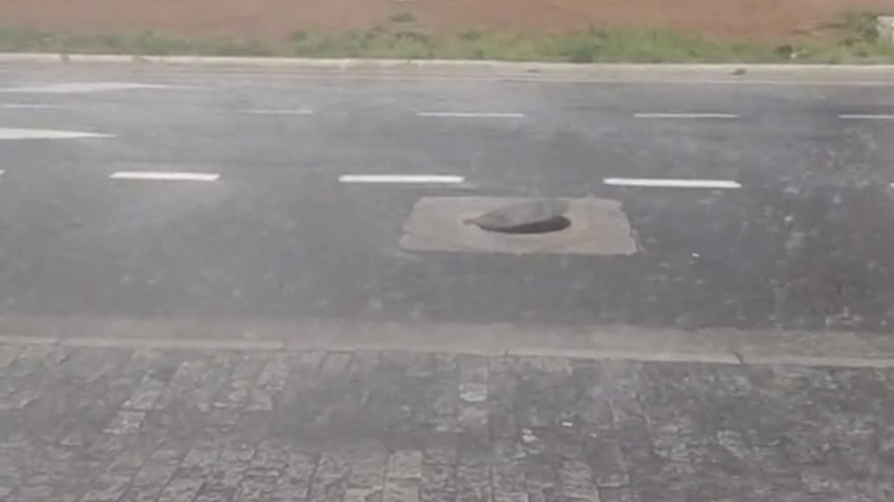 Water Pressure From Storm Creates a Bouncing Manhole Cover