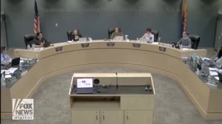 Arizona school board member, wearing cat ears during a meeting