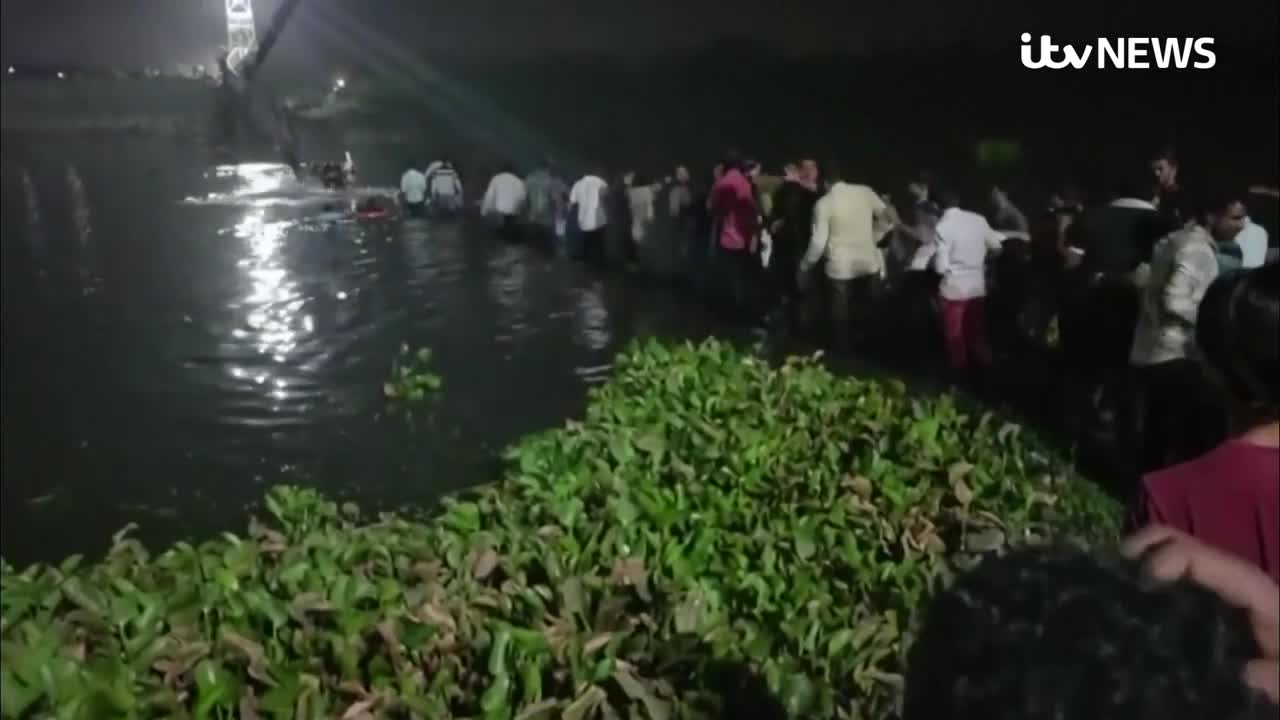 Dozens dead after cable bridge collapses in India