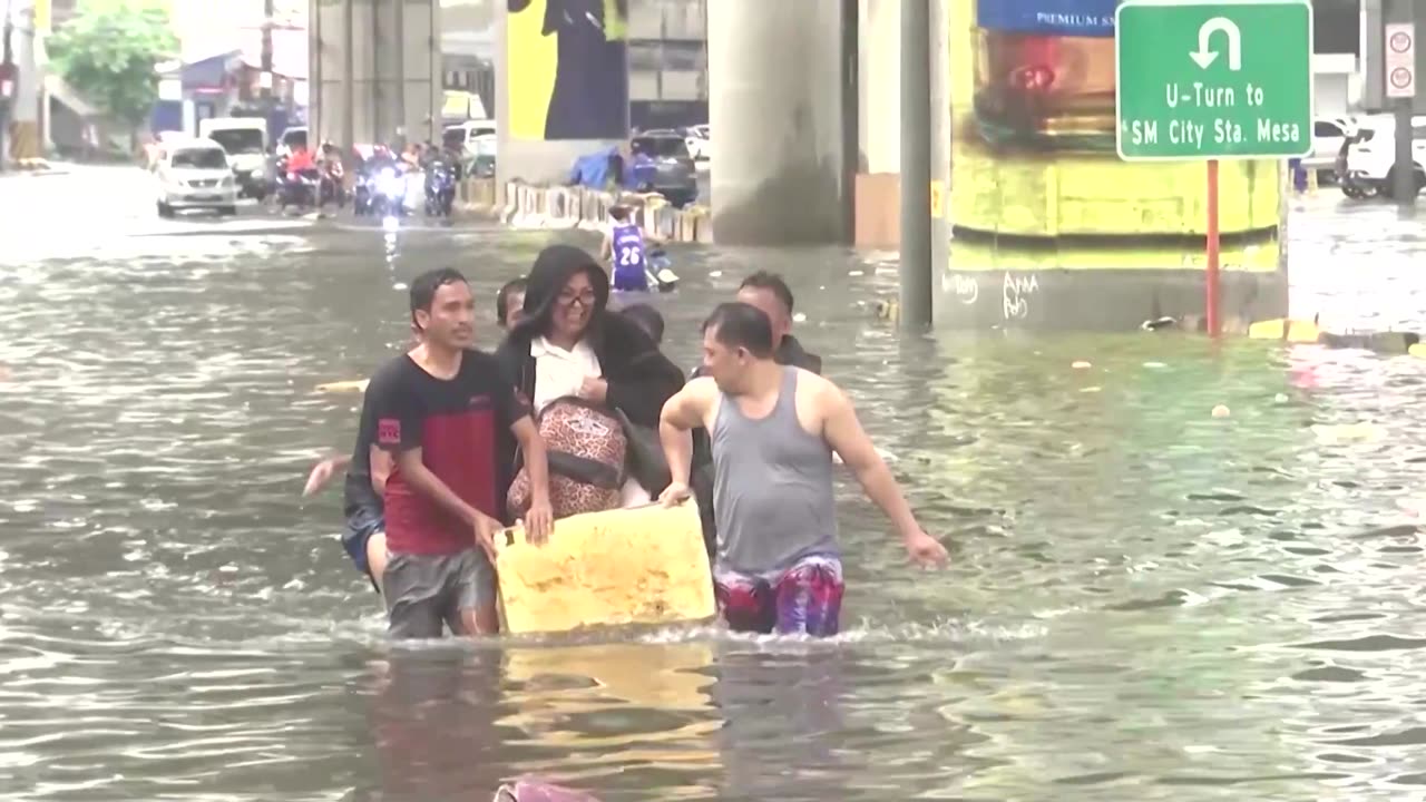 Heavy rain from Typhoon Gaemi floods Manila streets, homes