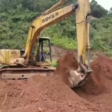 6 year old boy driving excavator