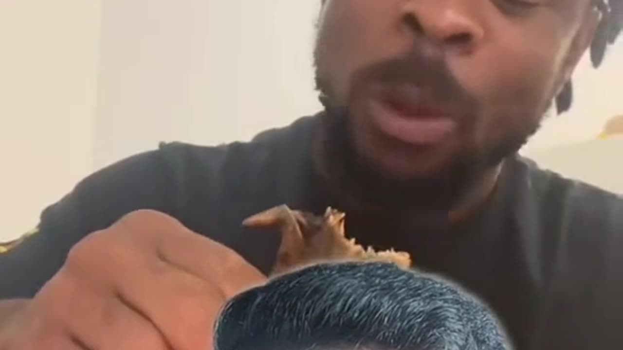 Man eats whole chicken like it's nothing and it's finger licking good