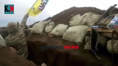 Some Ukranian Soldiers show the Nazy Flag on the battle