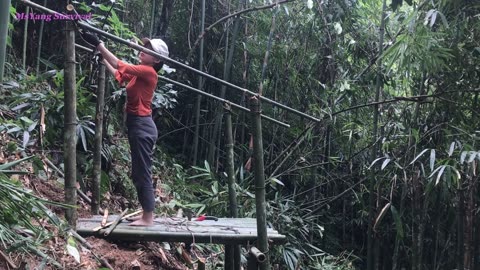 Bushcraft shelter in the rain, survival camping