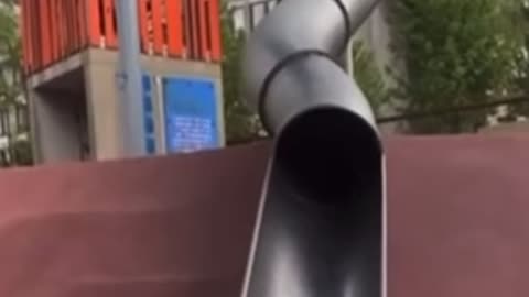 Cop falls down the slide