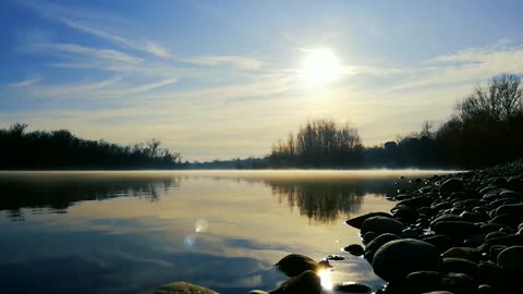 Sunrise view with calm lake and music for rest and relaxation