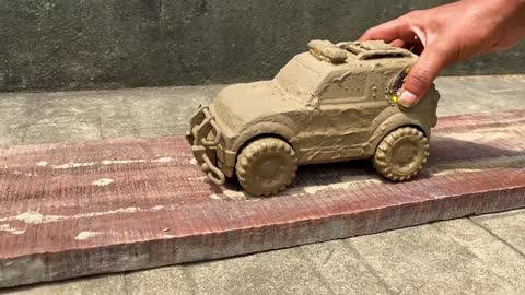 Drive the Muddy Toy Vehicle by hand and threw it into the water for cleaning