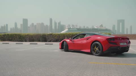 Thrilling Ride: Man Driving a Red Ferrari