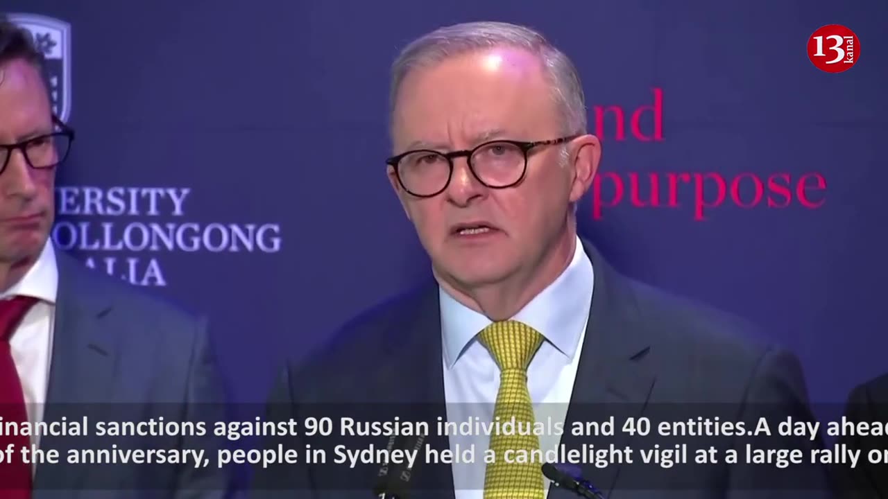 Rally and candlelight vigil, as Australia promises drones for Ukraine on anniversary