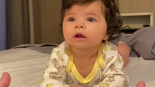 Baby Can't Decide Between Mom or Dad's Hand