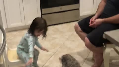 Playing ball in the kitchen in PJs