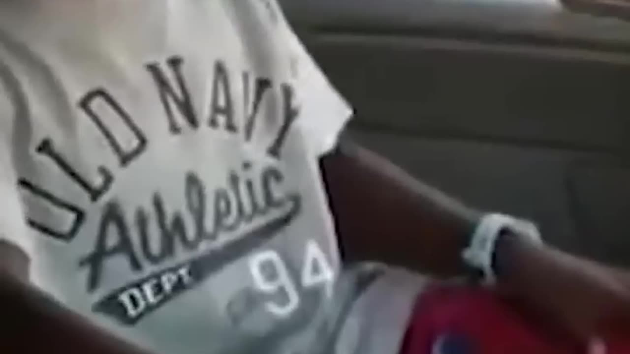 Black funny kid laughing in car vine